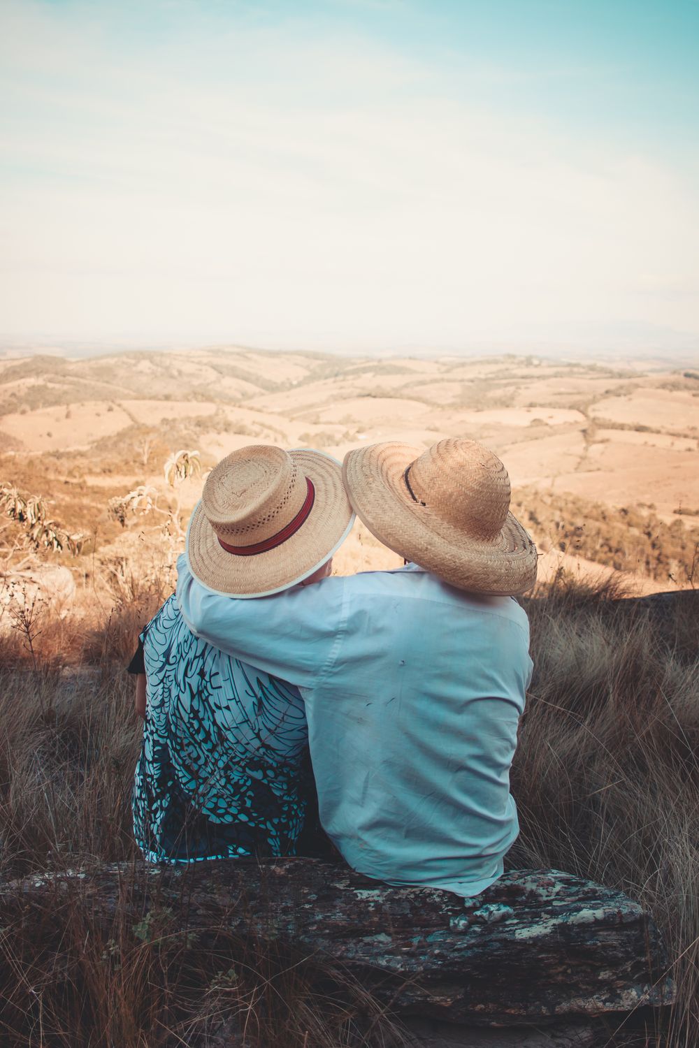 Loving couple embracing while enjoying a scenic view of the Brazilian countryside.